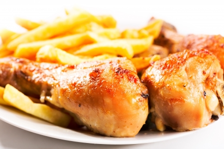roasted chicken leg with fries potatoの写真素材