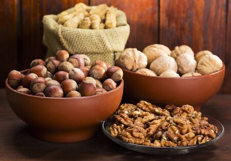 mix nuts on wooden tableの写真素材