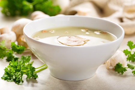 mushroom cream soup with fresh parsleyの写真素材
