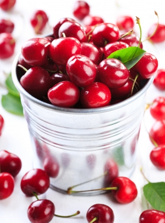 fresh cherries on wooden tableの写真素材