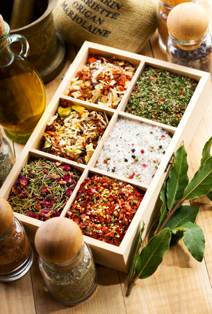various spices in wooden boxの写真素材