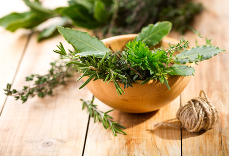 fresh herbs on wooden tableの写真素材