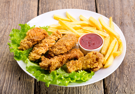 plate of fried chicken with vegetableの写真素材