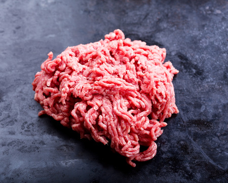 minced meat on black backgroundの写真素材