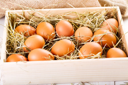 brown eggs in wooden boxの写真素材