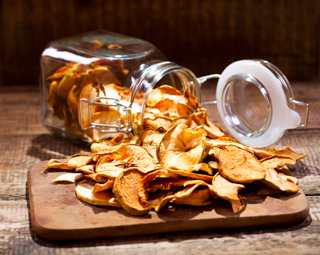 dried apples on wooden tableの写真素材