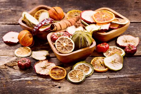 Fragrant decoration of dried fruits on a wooden tableの写真素材