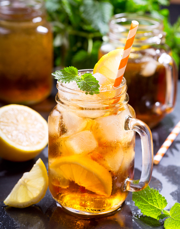 jar of lemon ice tea with striped strawの写真素材