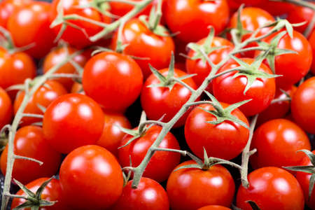 fresh red cherry tomatoes as backgroundの写真素材