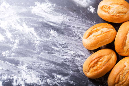 fresh bread on dark background, top viewの写真素材