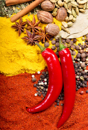 red chili peppers and mixed of various spices as background