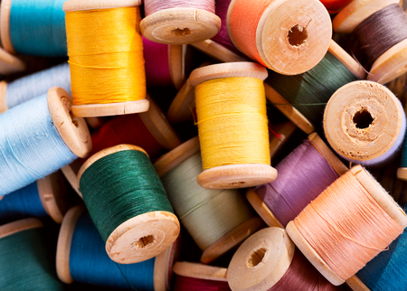 colorful thread spools as backgroundの写真素材