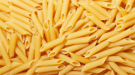 close up of penne pasta as backgroundの写真素材