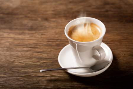 cup of coffee on wooden tableの写真素材