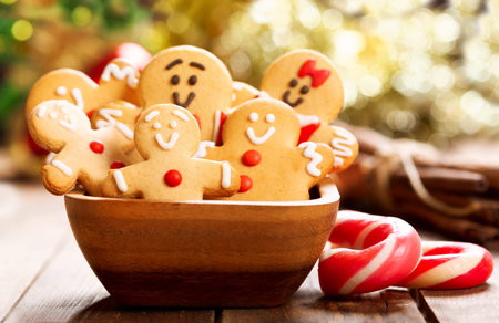Christmas food.  Homemade gingerbread cookies in a bowl on wooden table