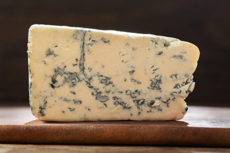 slice of blue cheese on wooden board