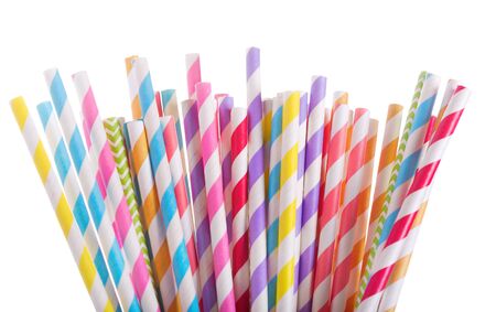 Colorful striped drinking straws isolated on whiteの写真素材