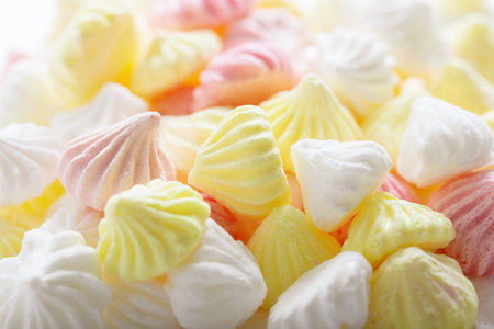 close up of colorful meringues as background