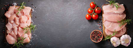 fresh turkey meat with rosemary on a wooden board, top viewの写真素材