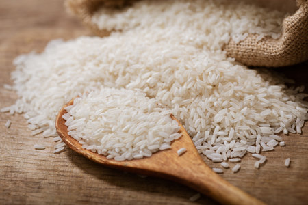 Close up of raw white rice on a wooden boardの写真素材