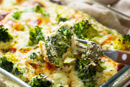 Casserole broccoli. Baked broccoli with cheese and cream sauce in baking dishの写真素材