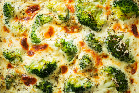 Casserole broccoli. Baked broccoli with cheese and cream sauce, as background. Top viewの写真素材