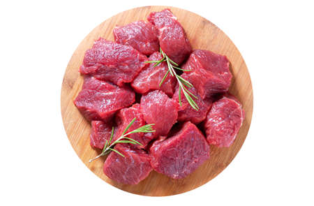 fresh chopped meat with parsley and spices on wooden board isolated on white background, top viewの写真素材