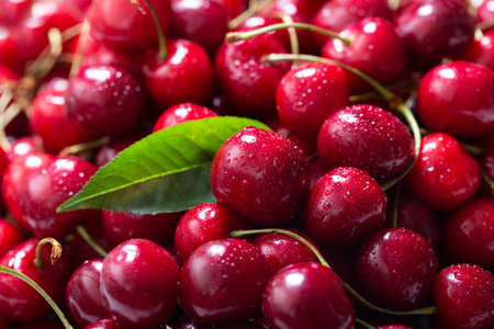 fresh ripe cherries as background, top view