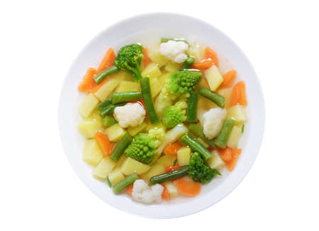 plate of vegetable soup isolated on white background, top viewの写真素材