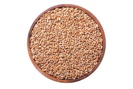 Bowl of wheat grains isolated on white background, top viewの写真素材