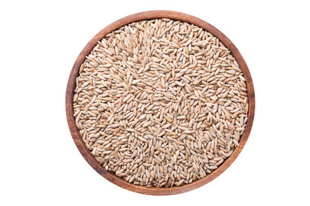 Bowl of rye grains isolated on white background, top viewの写真素材