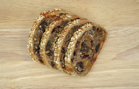 Slices of bread with dried fruit and seed.