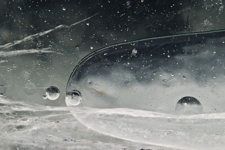 Frozen unusual universe of ovals and cracksの写真素材