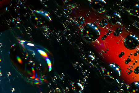 Multi-coloured drops on an iridescent surface