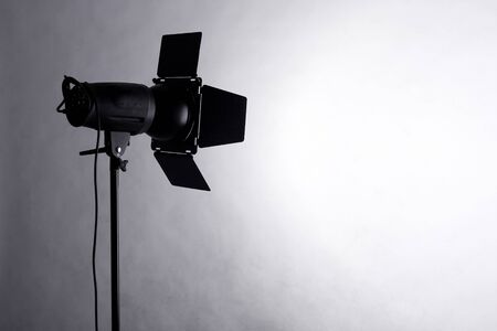 studio flash throwing a spotlight on the wallの写真素材