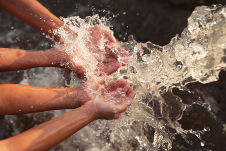Water flowing in to children hand, Water conservation, ecology and environment concept.の写真素材