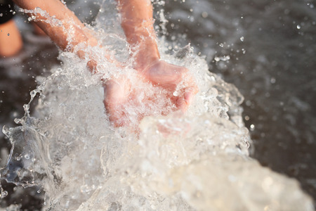 Hands of Children Cupped under canal water. Malnutrition, Climate change and Environment concept.の写真素材