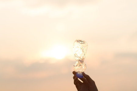 Hand up with plastic bottle metaphor recycle idea, polluted of plastic, separate trash concept