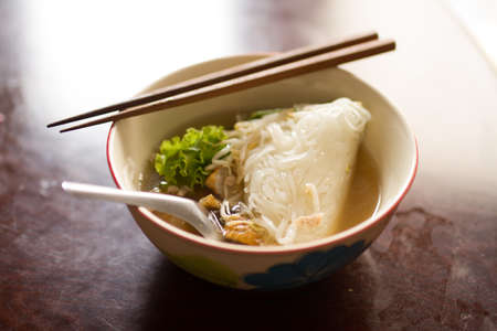 Chinese nooden on wood table at kitchenの写真素材