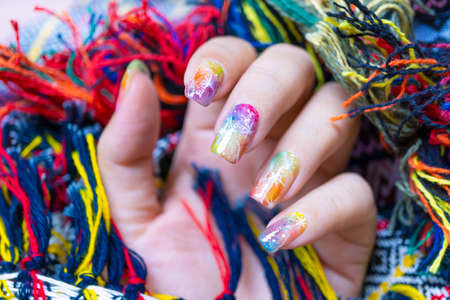 close up Colorful gel polish painting cute galaxy nail art on beautiful woman fingernailの写真素材