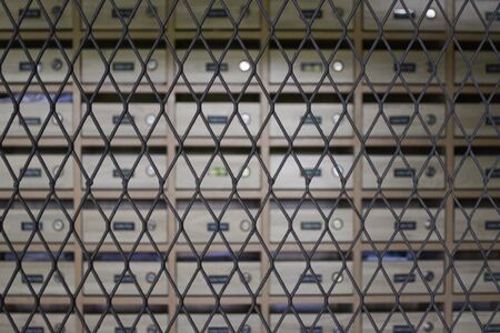 Lattice grating steel panel in the front of the mailbox room.の写真素材