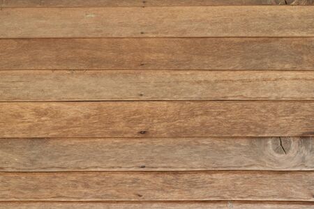Close-up horizontal stripes of wood plank brown texture backgroundの写真素材