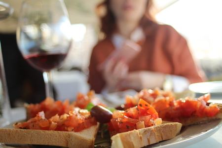 delicious toast on the table and the girl in the backgroundの写真素材