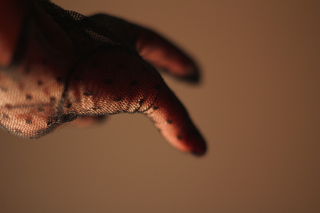 female hand and glove with black laceの写真素材