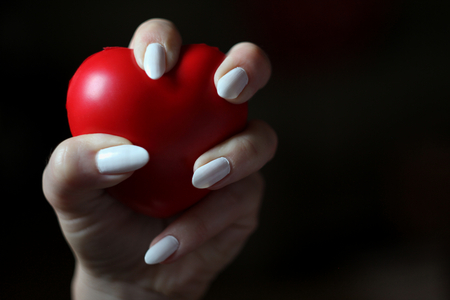 Red heart in the handの写真素材