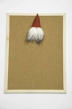 Santa Claus toy on cork board - Christmas concept imageの写真素材