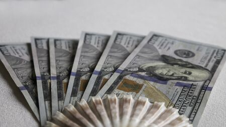 Sea fan of a banknotes of hundred dollars on a white backgroundの写真素材