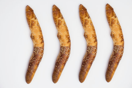 Traditional Balkan baguettes (or kifli) roll on white background.