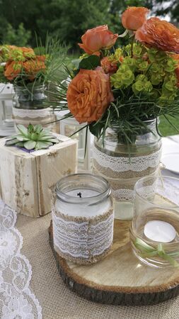 Retro wooden and flower decoration of the table in the gardenの写真素材