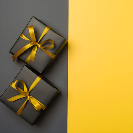 Black and yellow gift boxes on black and yellow background with copy spaceの素材